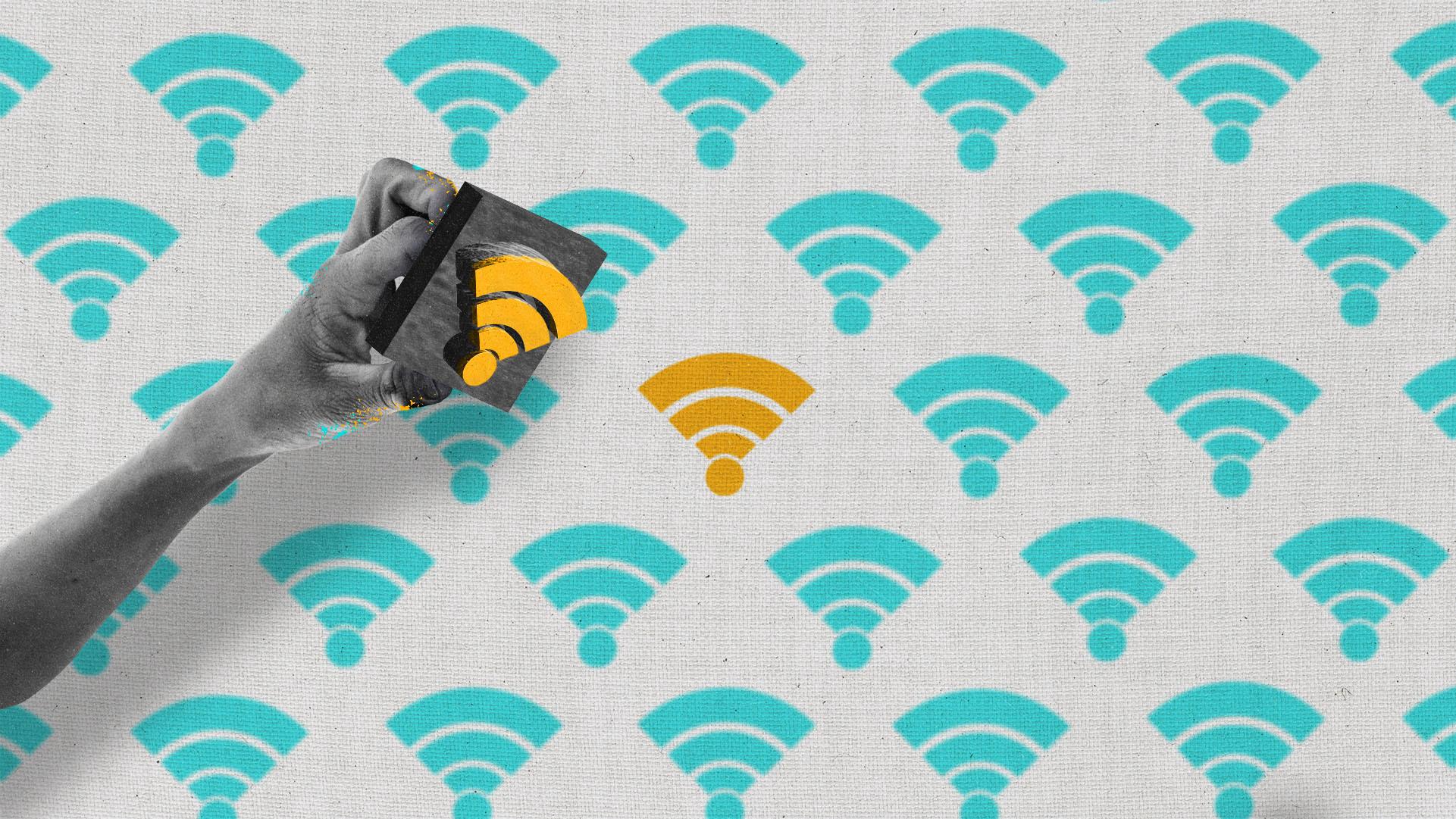 A hand hovers over fabric holding a block print of a wifi symbol. The fabric has a wifi symbol printed pattern.