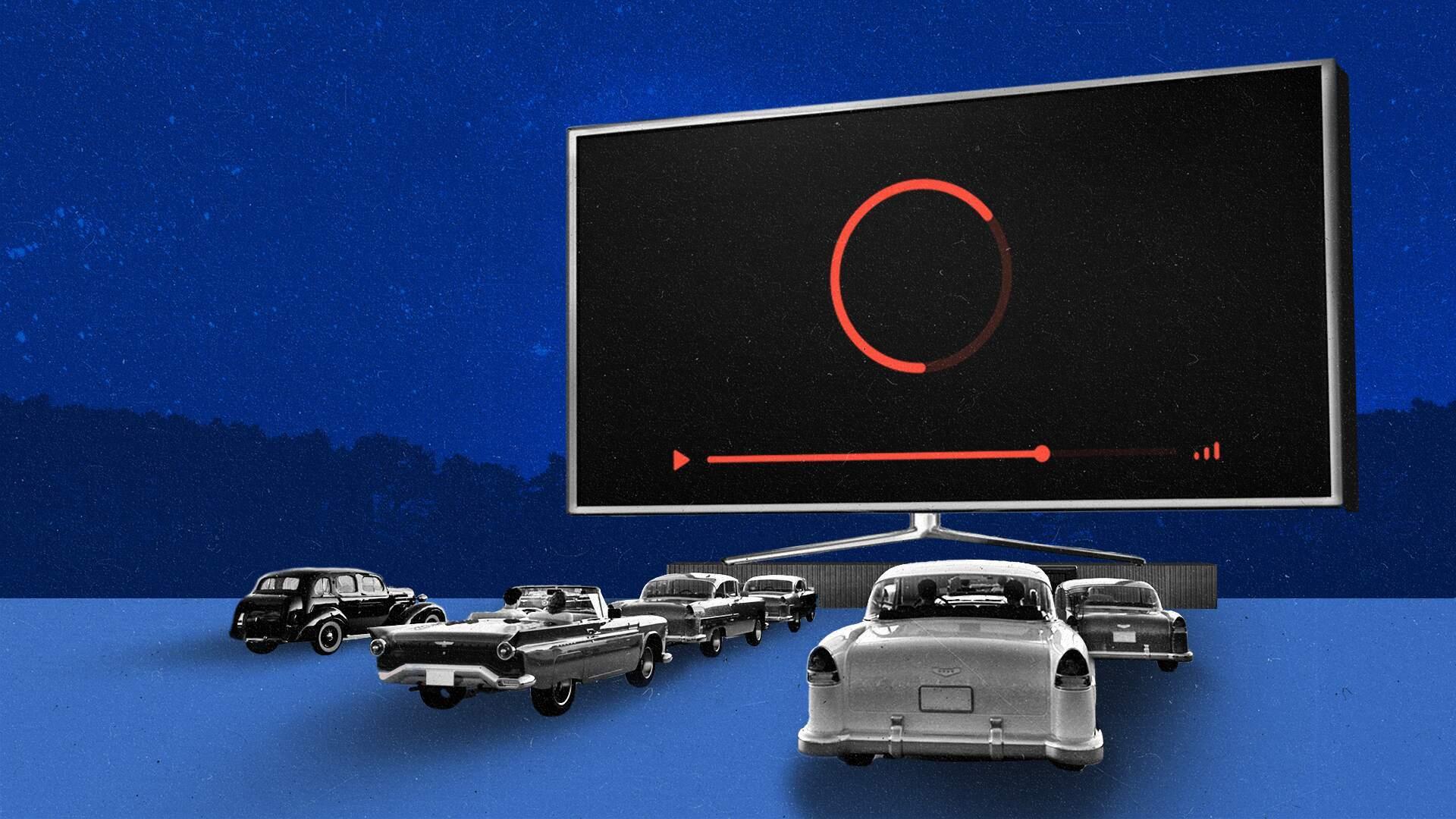 A series of vintage cars are parked outside watching a giant, oversized Connected TV at night.