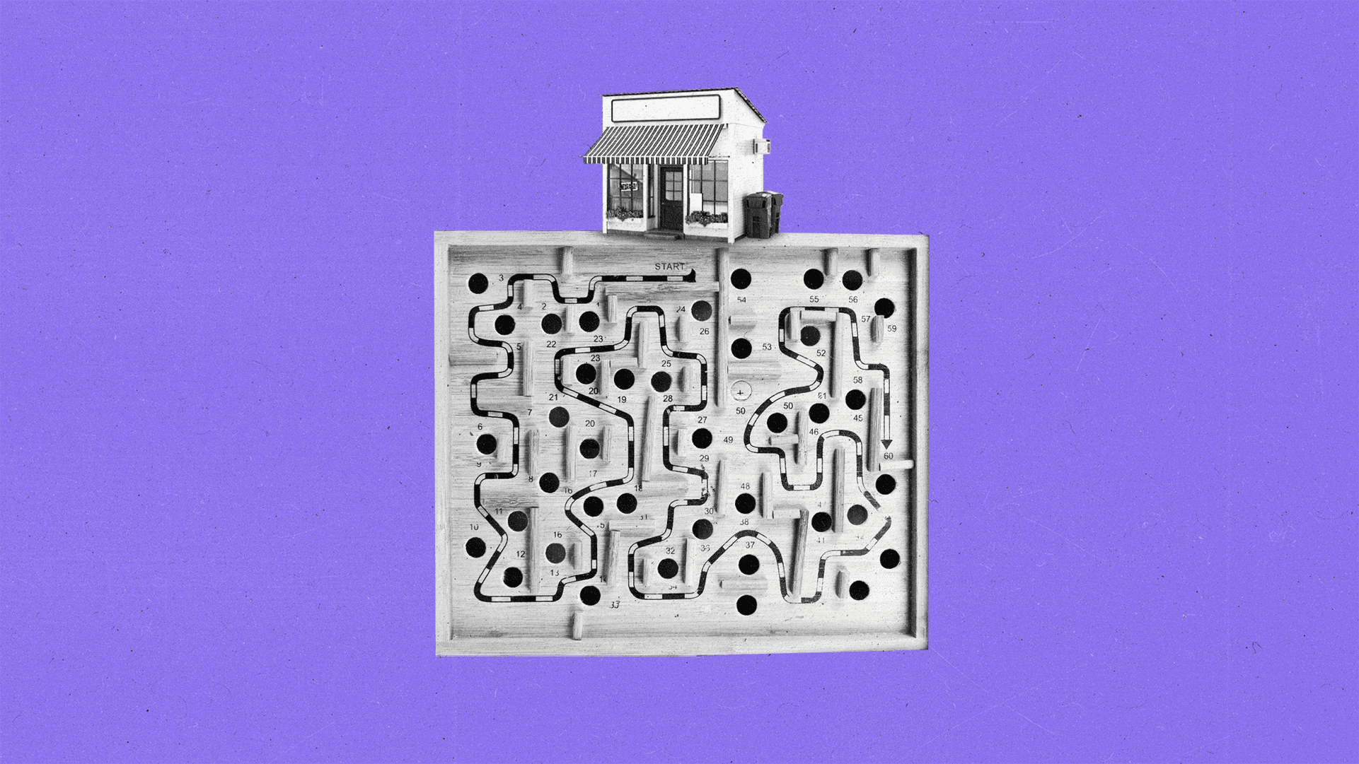 A small storefront rests on top of a wooden maze.