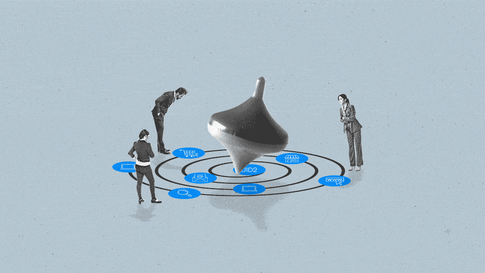 Three people in business attire watch a top as it spins on a path to purchase for a consumer.