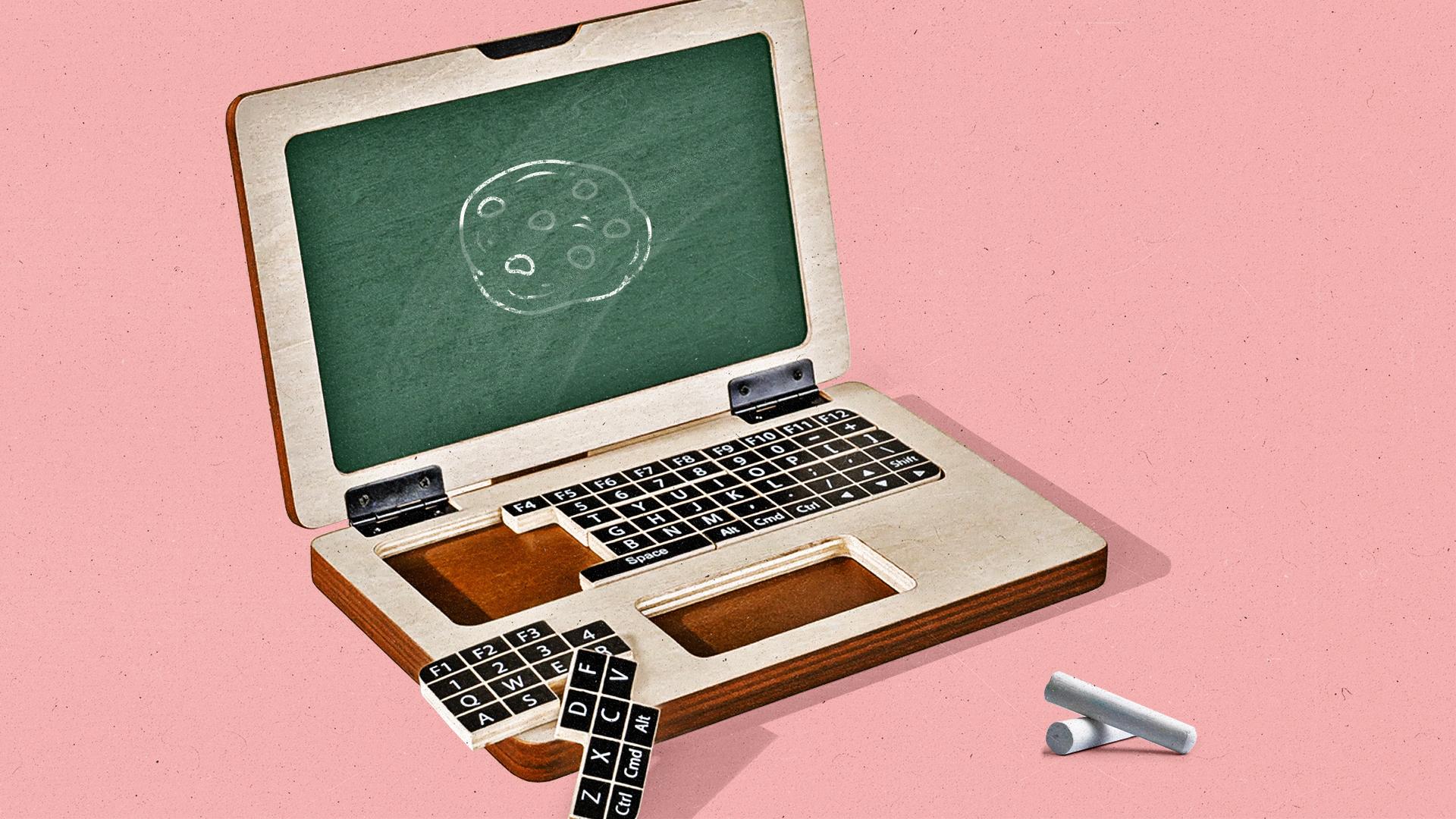 A laptop with keys missing shows a green screen with a cookie on it.