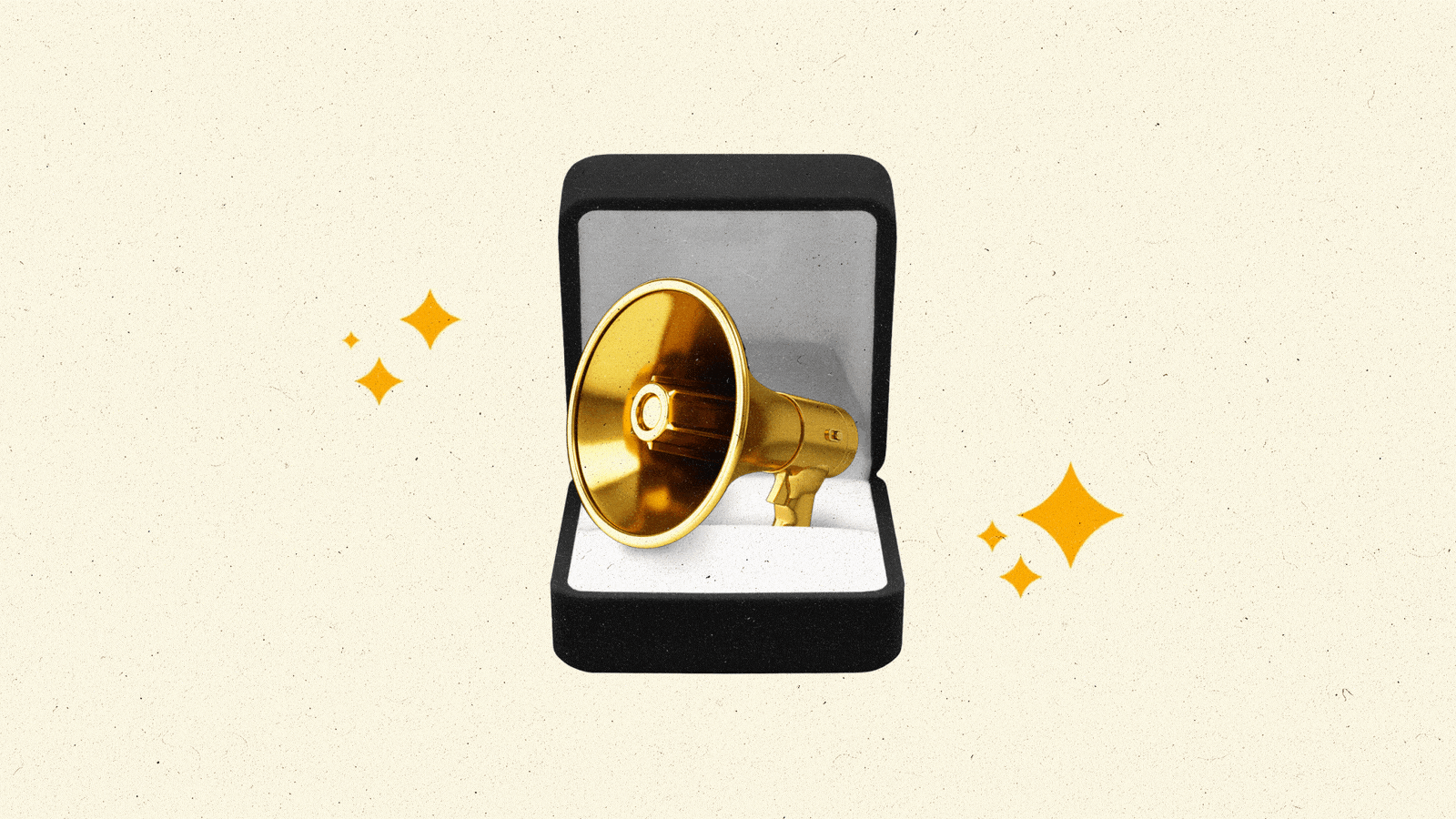 A ring box containing a golden megaphone sparkles.